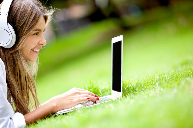 Woman typing on laptop.